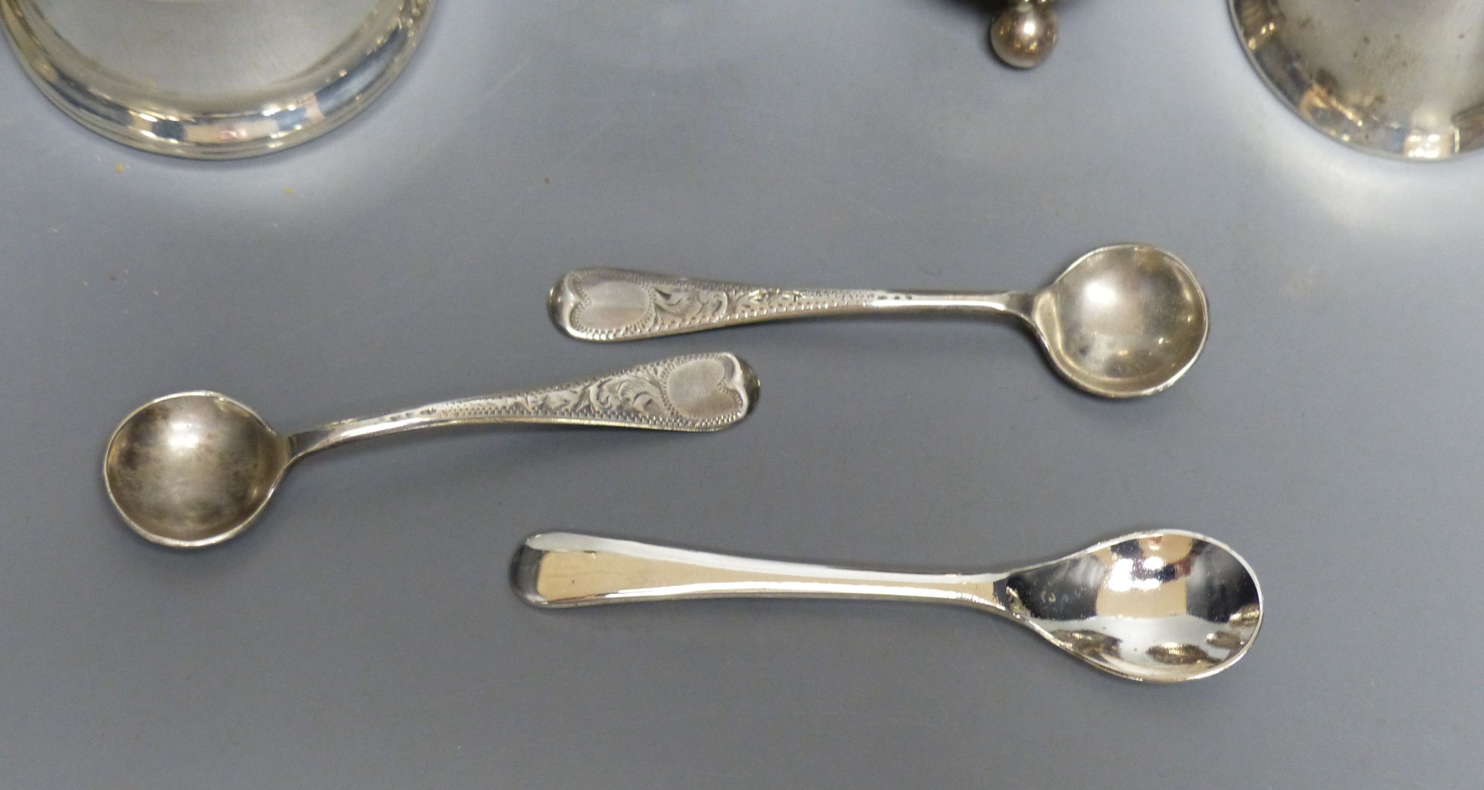 A collection of silver condiments, including a Norwegian 'Viking' longboat salt,